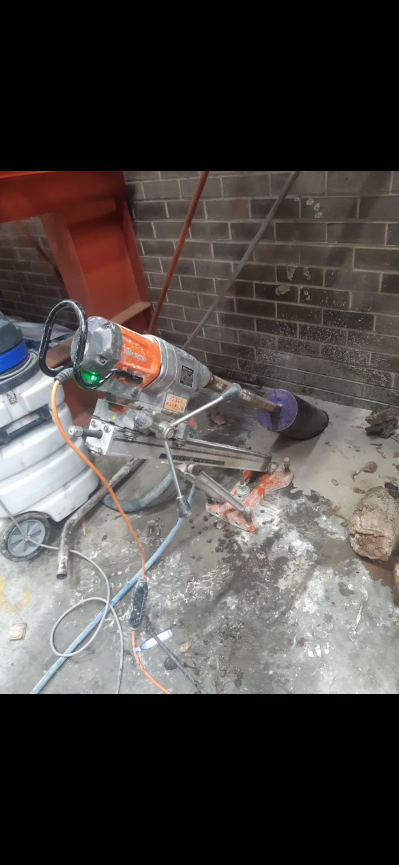 Wall drilling in progress